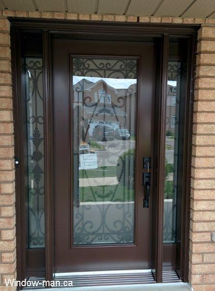 Front door and two sidelights. Steel front entry exterior. Brown. Nutmeg. Wrought iron glass inserts. Portland full glass design